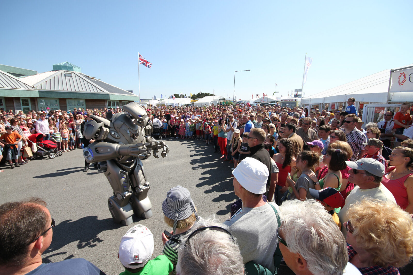 Massive crowd gathered around Titan the Robot at a live show
