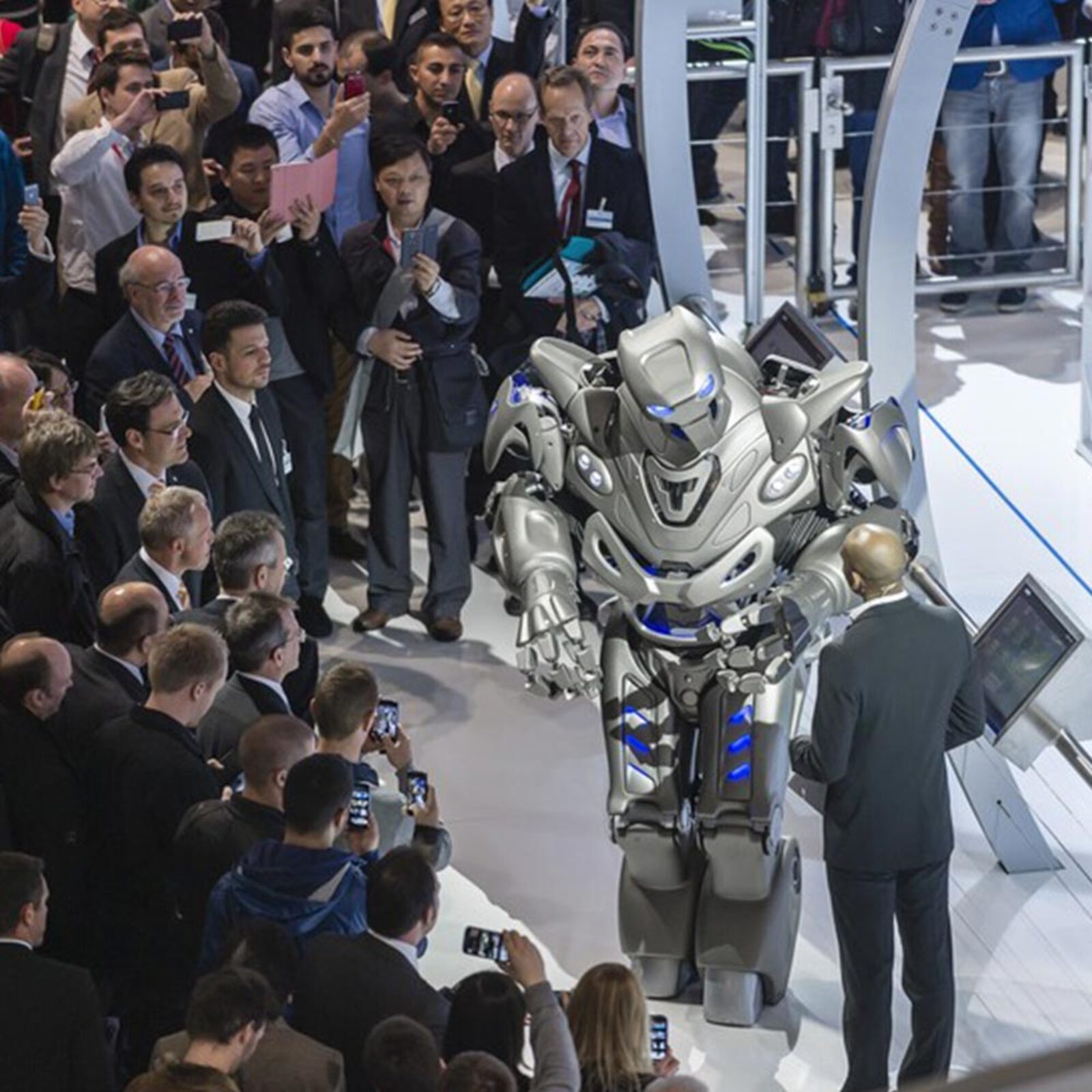 Titan the Robot drawing a media crowd at a Siemens trade show
